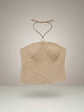 Top halter de gamuza color hueso de Pampa Boho con remaches y cuello ajustable.